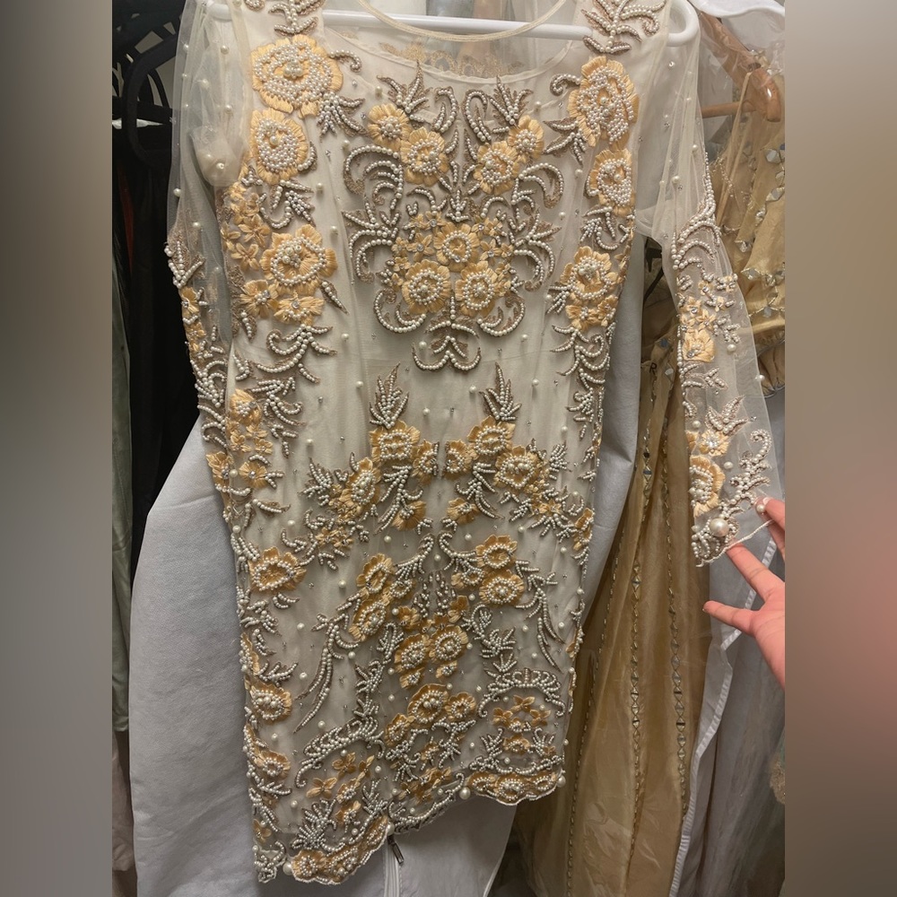 Lovely kurta on organza with liking w/ matching pants. Thread & bead embroidery